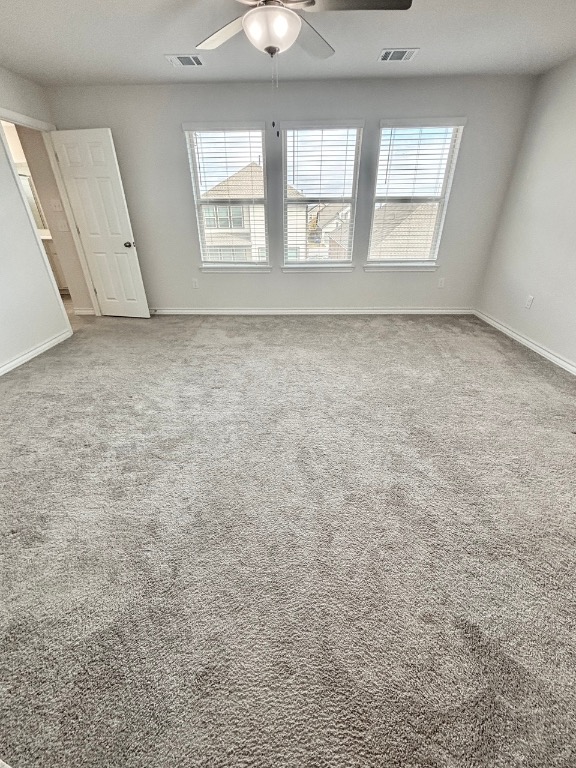 7606 Elk Grove Path Austin, TX 78653 - Photo 19 of 40 Spare room with plenty of natural light and light carpet