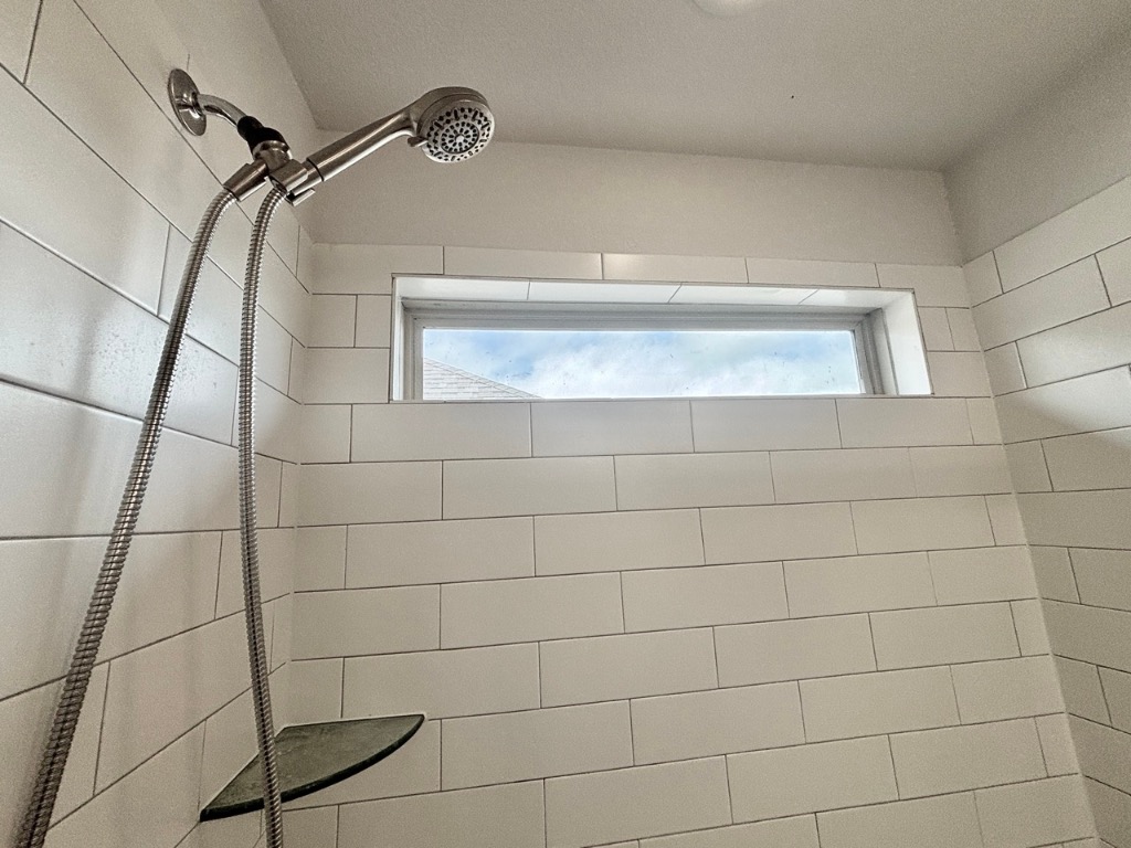 7606 Elk Grove Path Austin, TX 78653 - Photo 21 of 40 Bathroom view of a tile shower