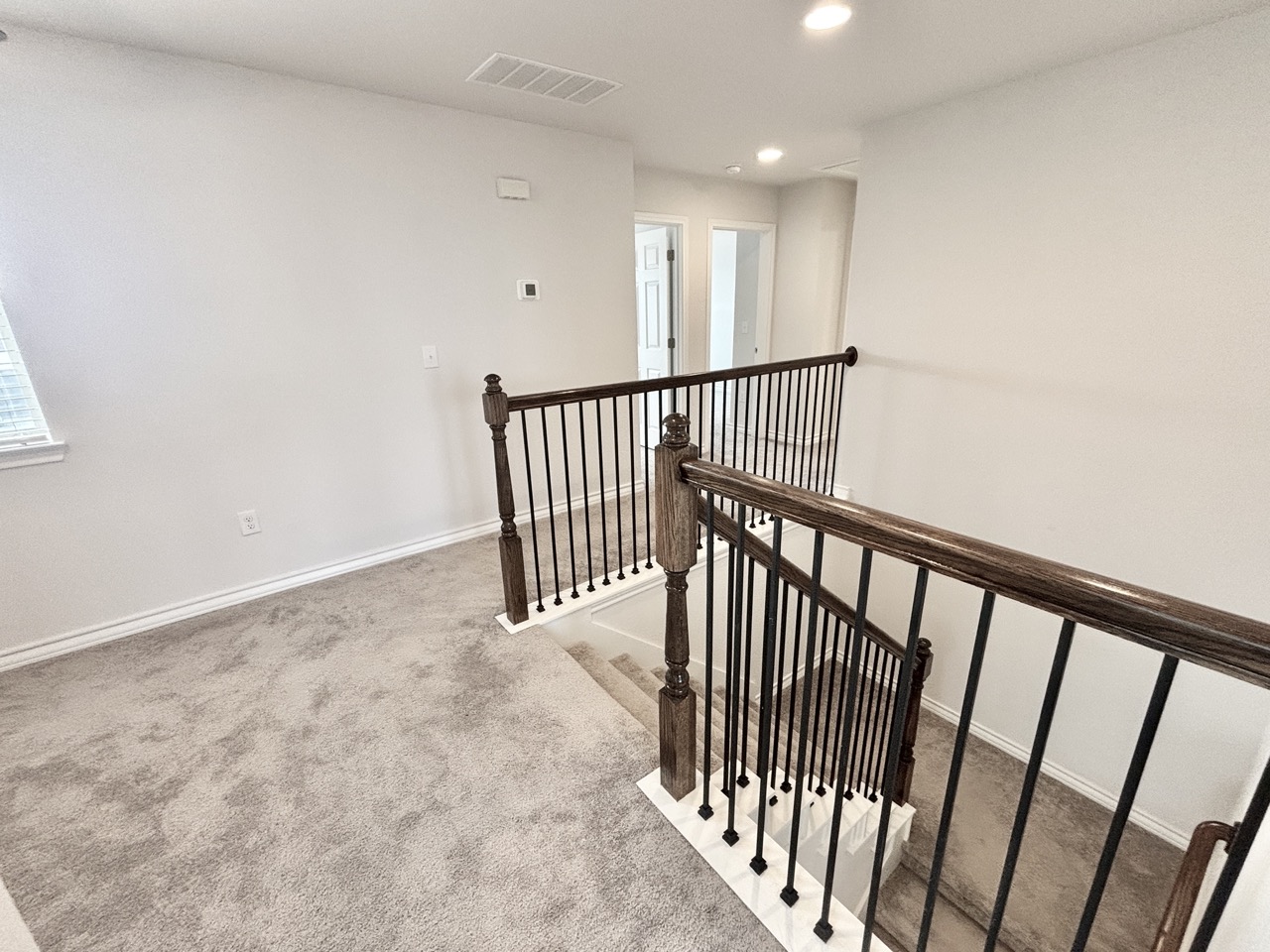 7606 Elk Grove Path Austin, TX 78754 - Photo 23 of 40 Corridor with carpet, an upstairs landing, and recessed lighting