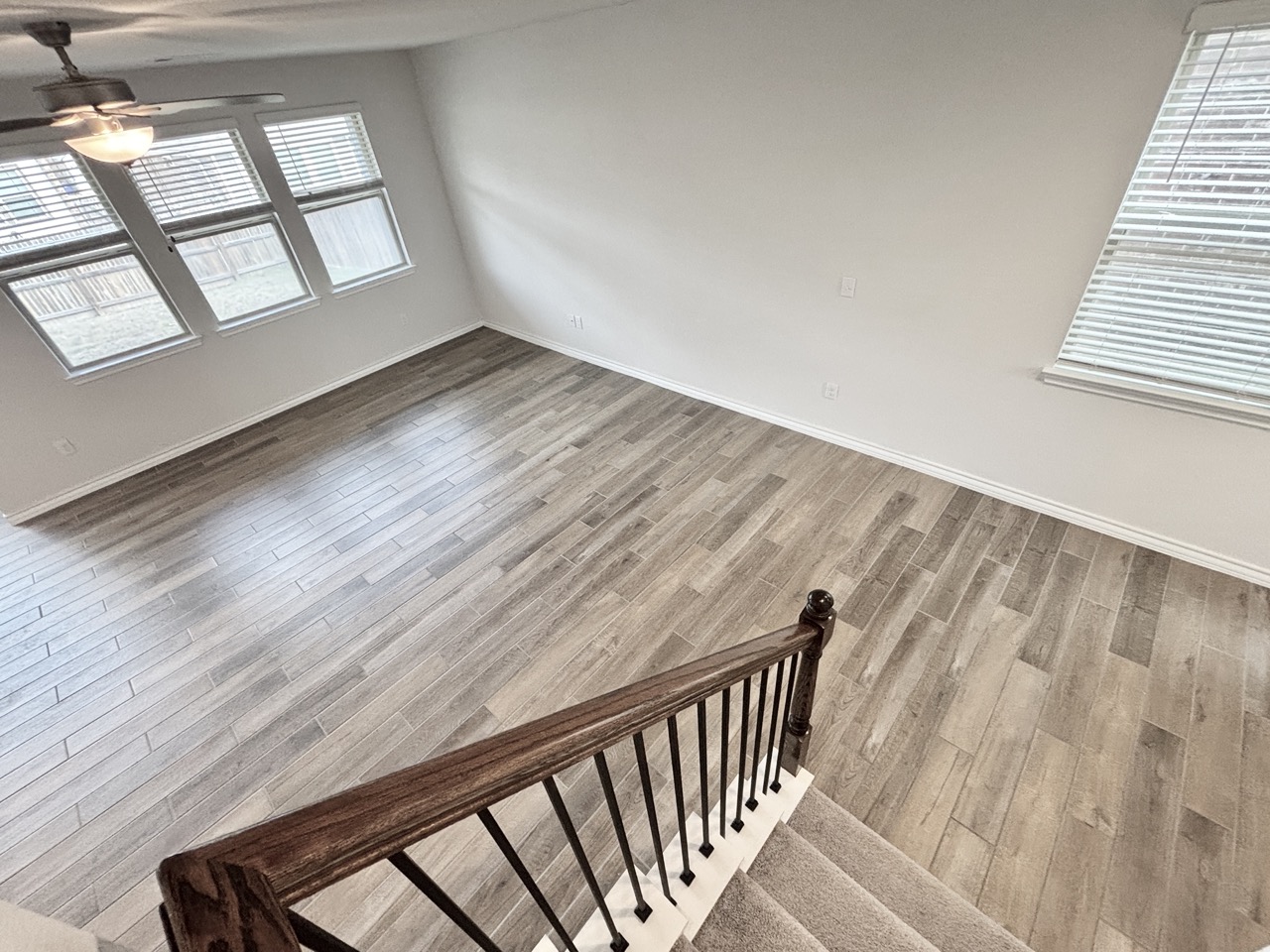 7606 Elk Grove Path Austin, TX 78754 - Photo 29 of 40 Stairway with wood finished floors and plenty of natural light