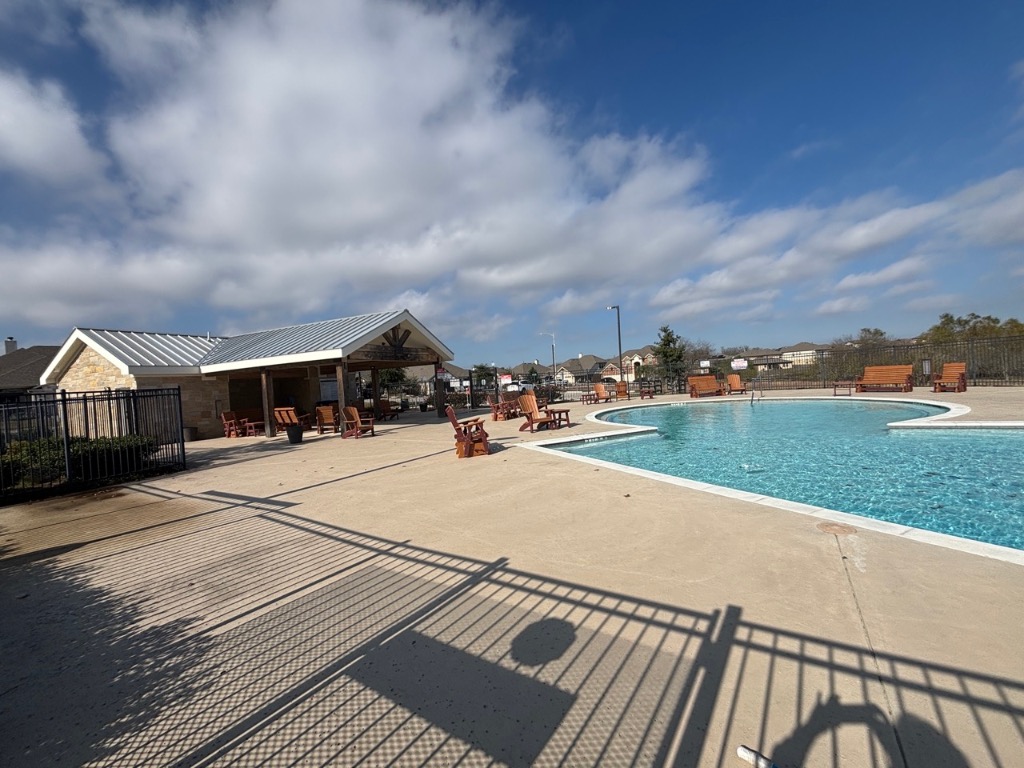7606 Elk Grove Path Austin, TX 78653 - Photo 33 of 40 Community pool featuring a patio