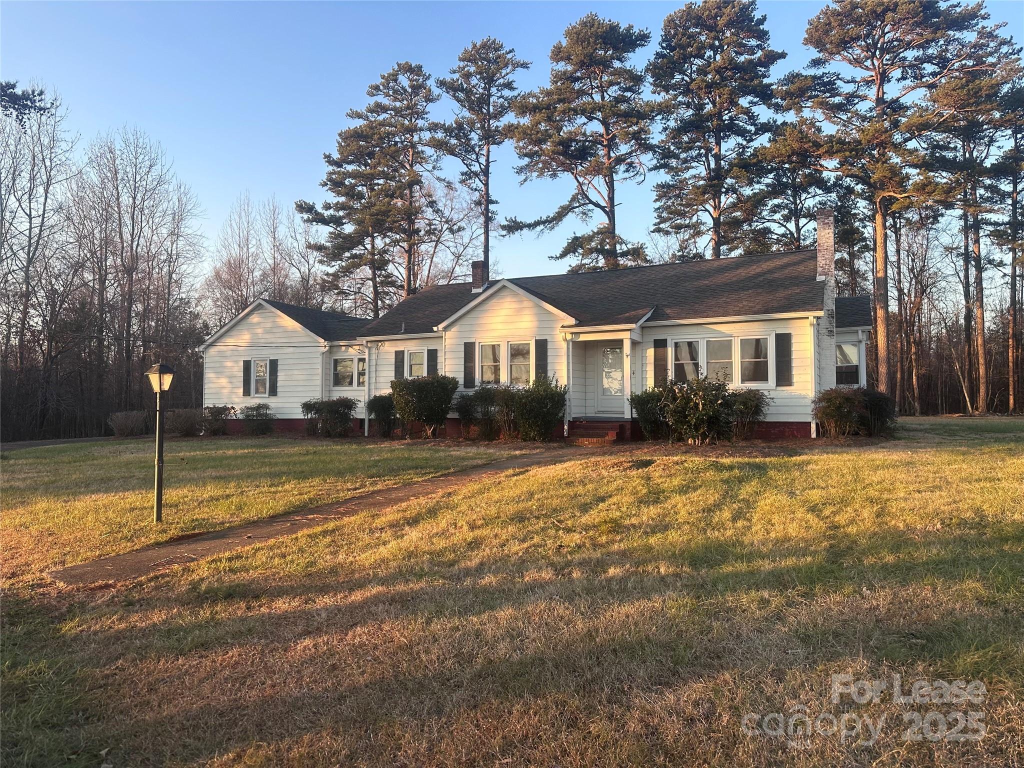 a house with trees in the background