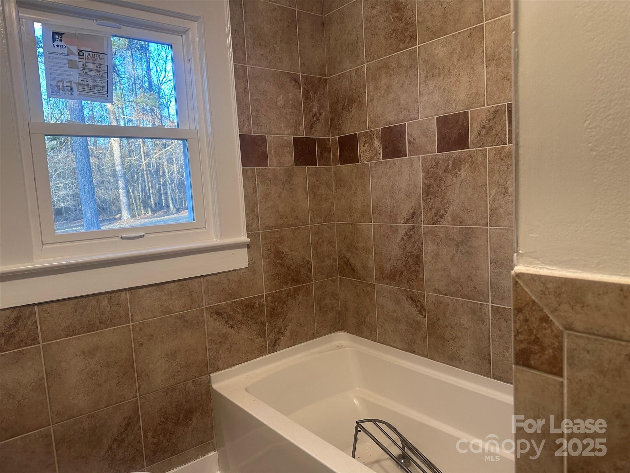 1255 Highway 24 Midland, NC 28107 - Photo 21 of 27 a bath tub sitting next to a window