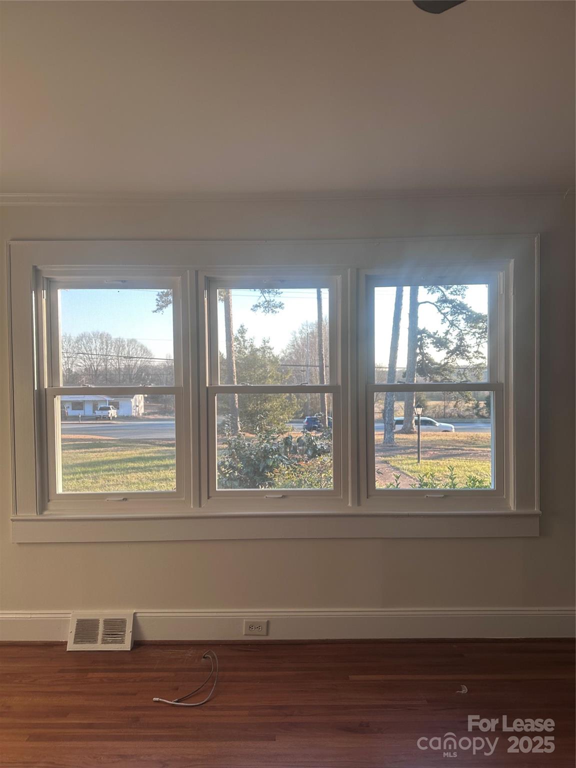 1255 Highway 24 Midland, NC 28107 - Photo 26 of 27 a view of an empty room with wooden floor and a window