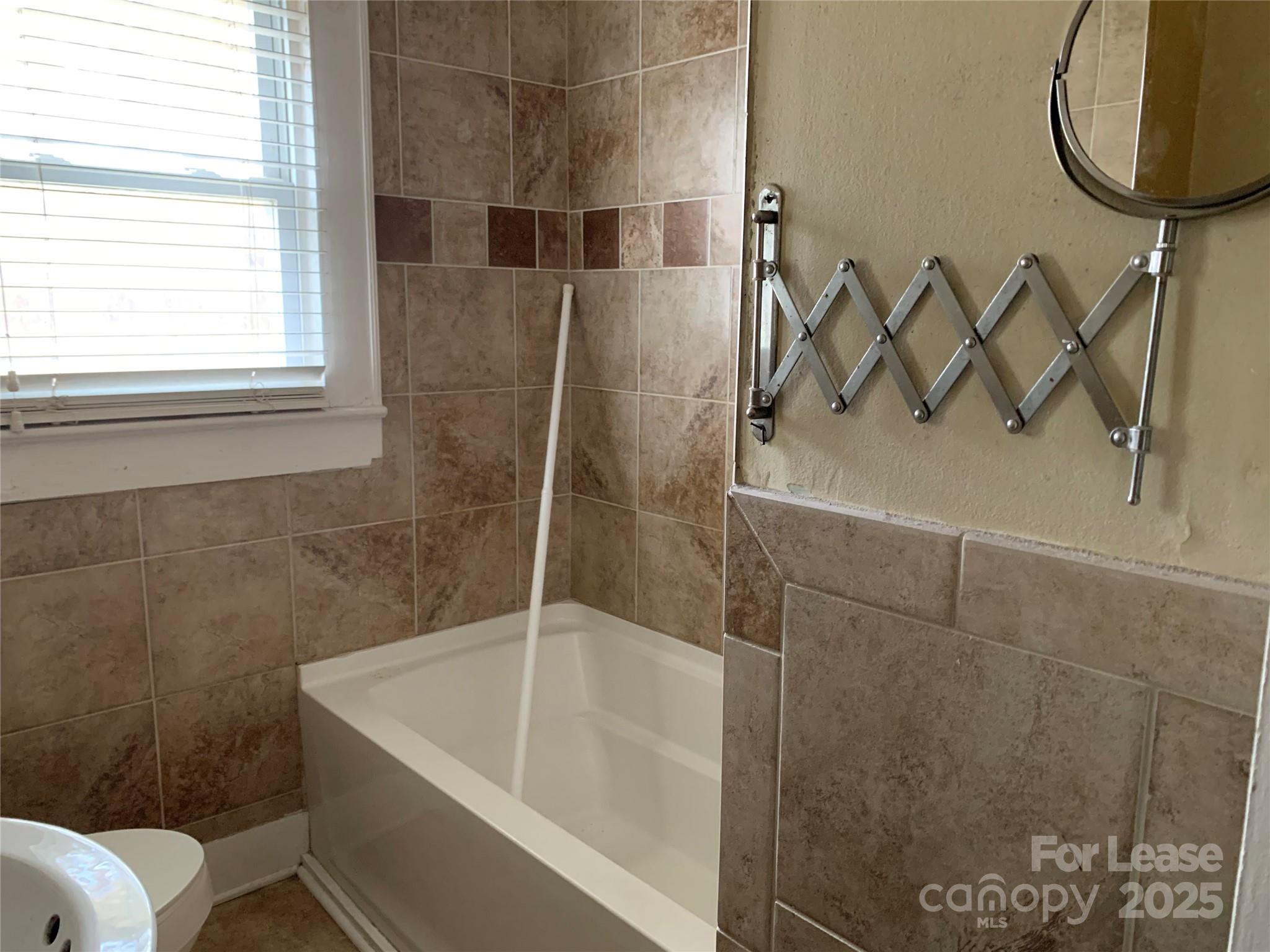 1255 Highway 24 Midland, NC 28107 - Photo 6 of 27 a bathroom with a sink a toilet and a shower