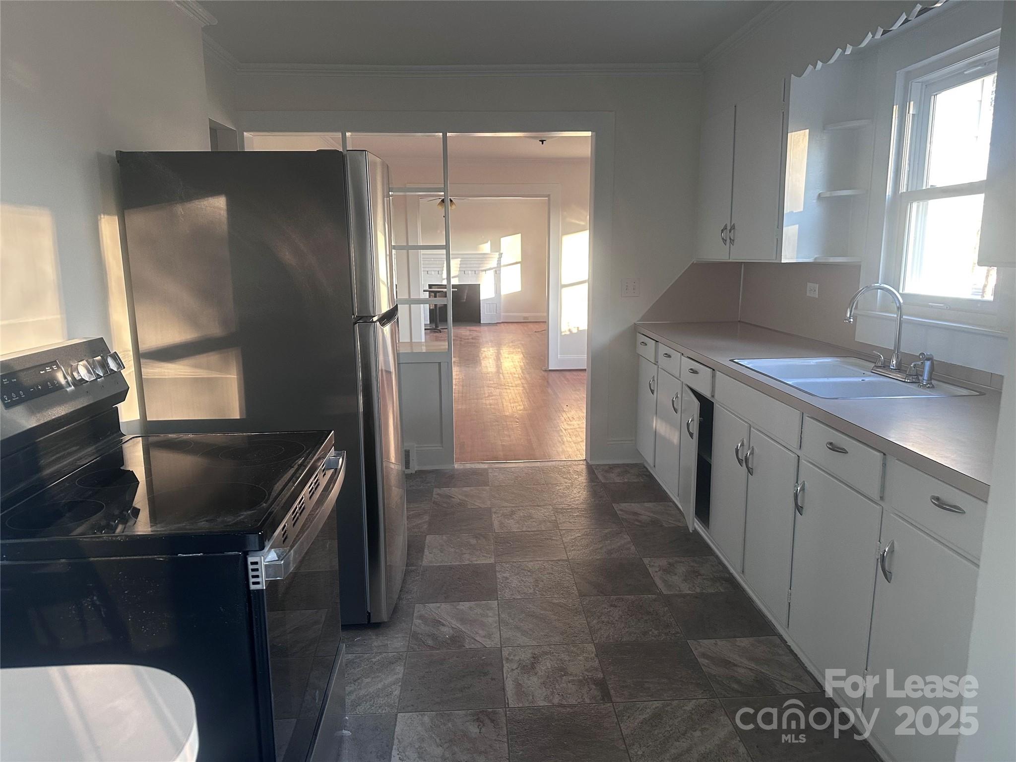 1255 Highway 24 Midland, NC 28107 - Photo 9 of 27 a kitchen with a sink and refrigerator