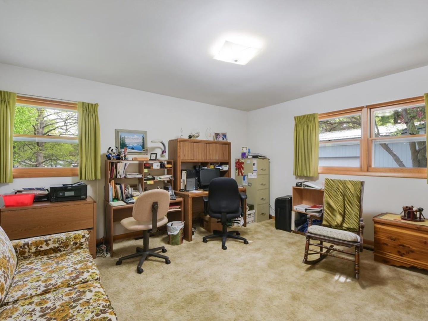802 Adams Court Monticello, IL 61856 - Photo 14 of 25 a view of a workspace with a window and lounge chair