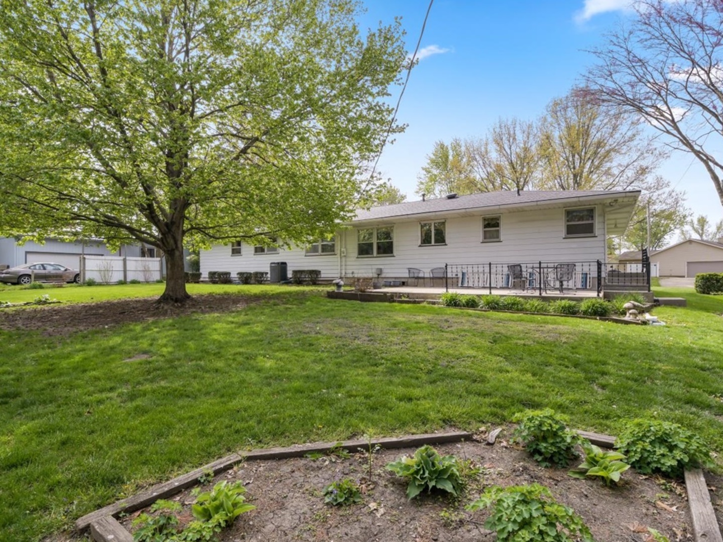 802 Adams Court Monticello, IL 61856 - Photo 25 of 25 a front view of house with yard and green space
