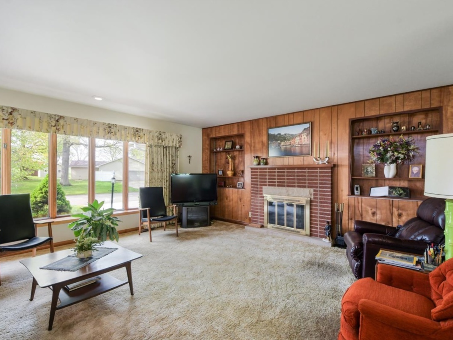 802 Adams Court Monticello, IL 61856 - Photo 3 of 25 a living room with furniture a fireplace and a flat screen tv