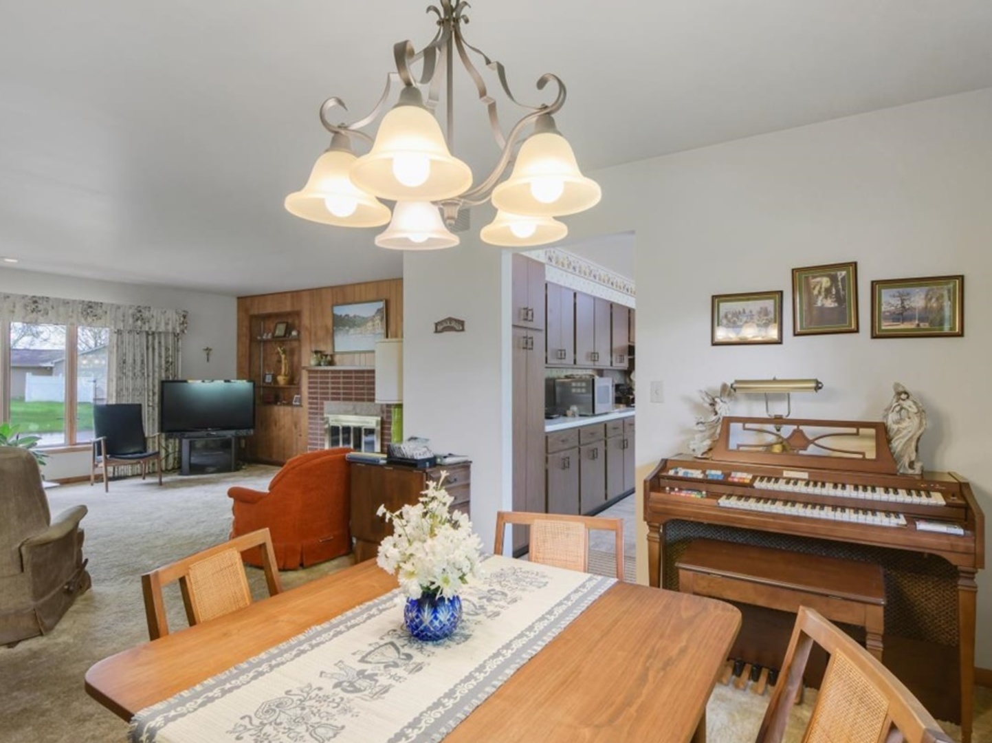 802 Adams Court Monticello, IL 61856 - Photo 6 of 25 a living room with furniture dining table and a chandelier