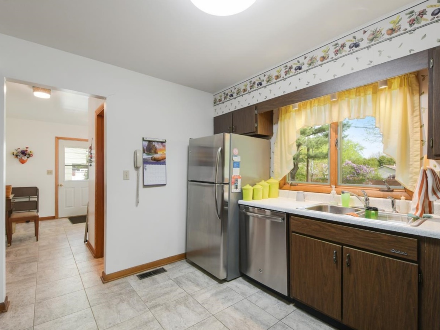 802 Adams Court Monticello, IL 61856 - Photo 8 of 25 a kitchen with a window a refrigerator and a sink