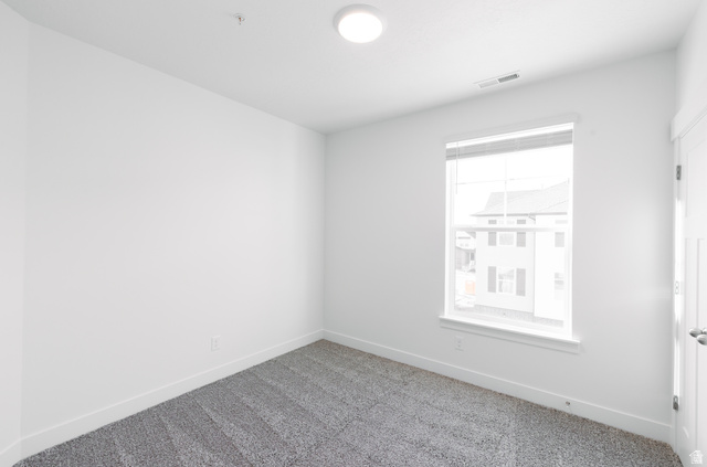 4655 South 720 West, Unit I303 Mapleton, UT 84664 - Photo 7 of 15 Spare room with baseboards and carpet