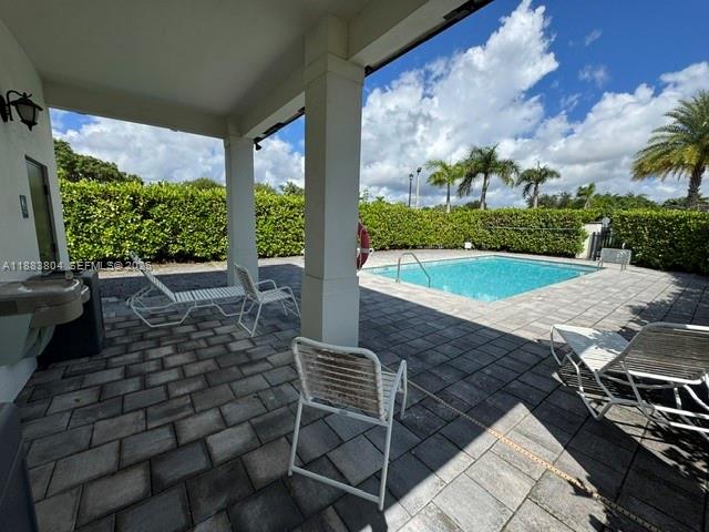 22509 Southwest 102nd Avenue Miami, FL 33190 - Photo 11 of 39 a view of outdoor space patio and swimming pool