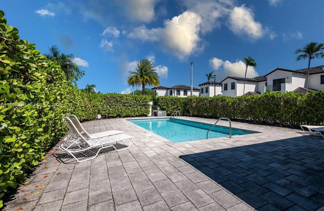 22509 Southwest 102nd Avenue Miami, FL 33190 - Photo 12 of 39 a view of a pool with a yard