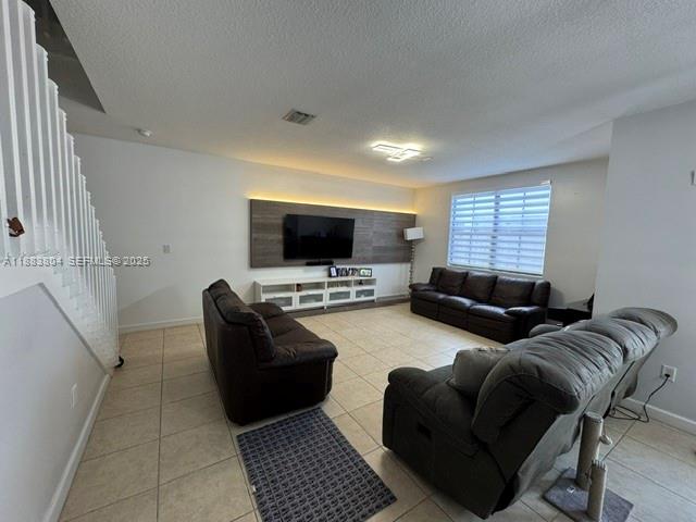 22509 Southwest 102nd Avenue Miami, FL 33190 - Photo 15 of 39 a living room with furniture and a flat screen tv