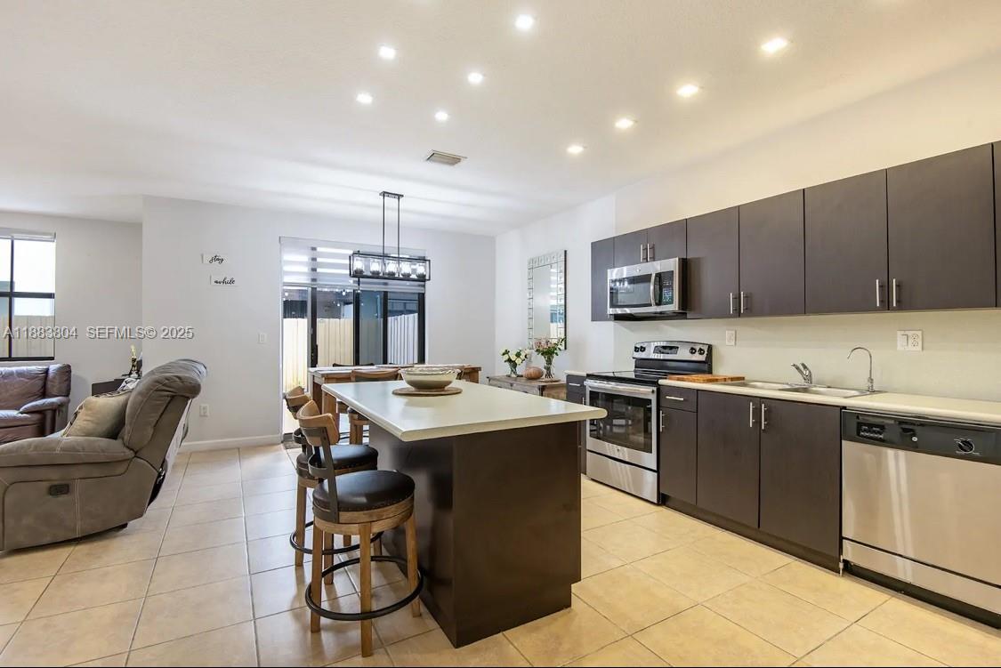 22509 Southwest 102nd Avenue Miami, FL 33190 - Photo 19 of 39 a kitchen with granite countertop lots of counter top space