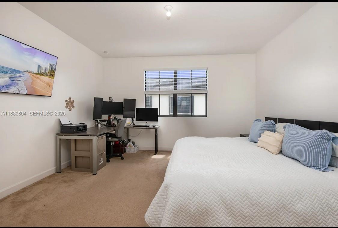 22509 Southwest 102nd Avenue Miami, FL 33190 - Photo 24 of 39 a bedroom with a bed window and chair