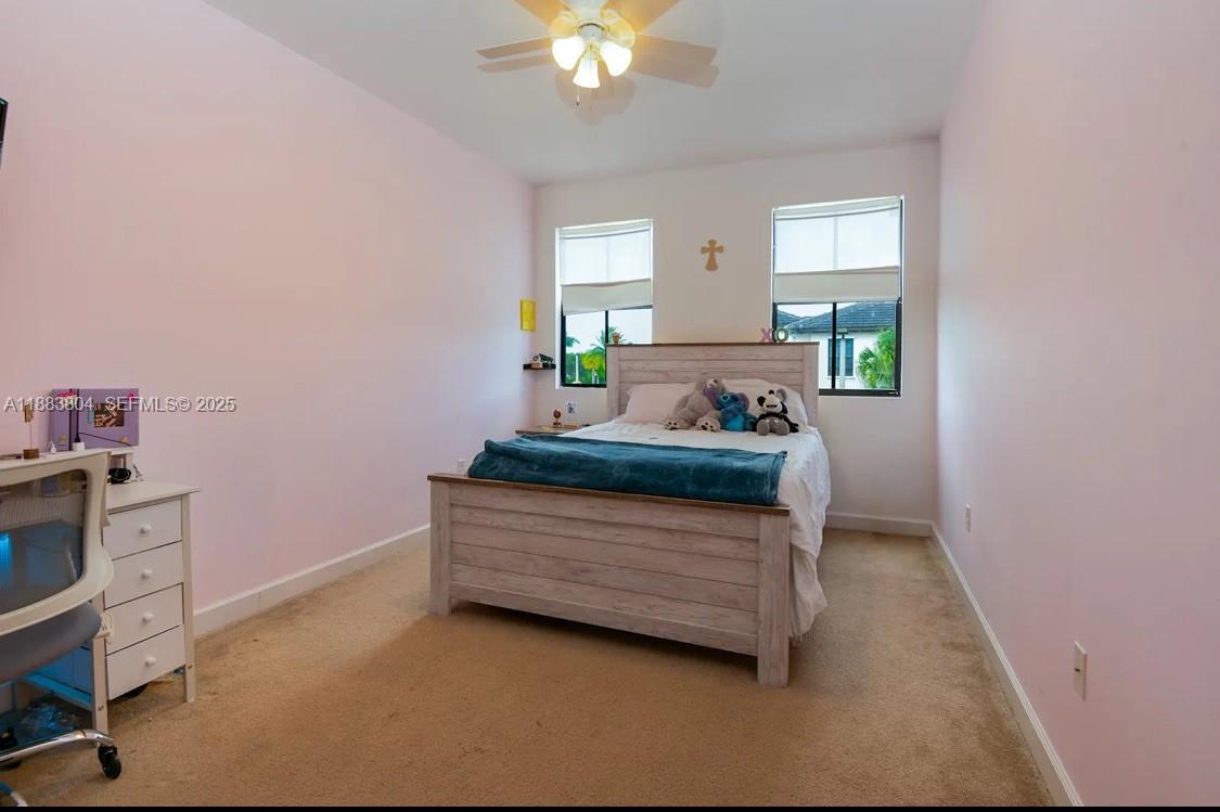 22509 Southwest 102nd Avenue Miami, FL 33190 - Photo 29 of 39 a living room with furniture and window