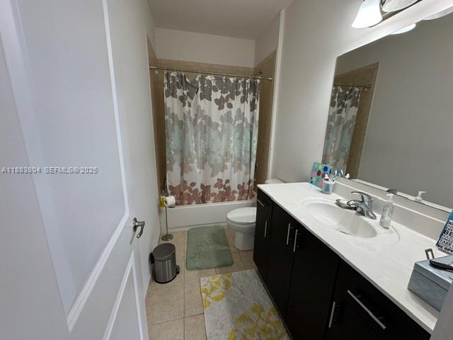22509 Southwest 102nd Avenue Miami, FL 33190 - Photo 30 of 39 a bathroom with a double vanity sink toilet and shower