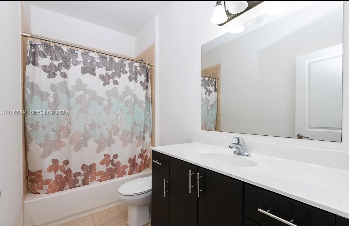 22509 Southwest 102nd Avenue Miami, FL 33190 - Photo 31 of 39 a bathroom with a sink and a mirror