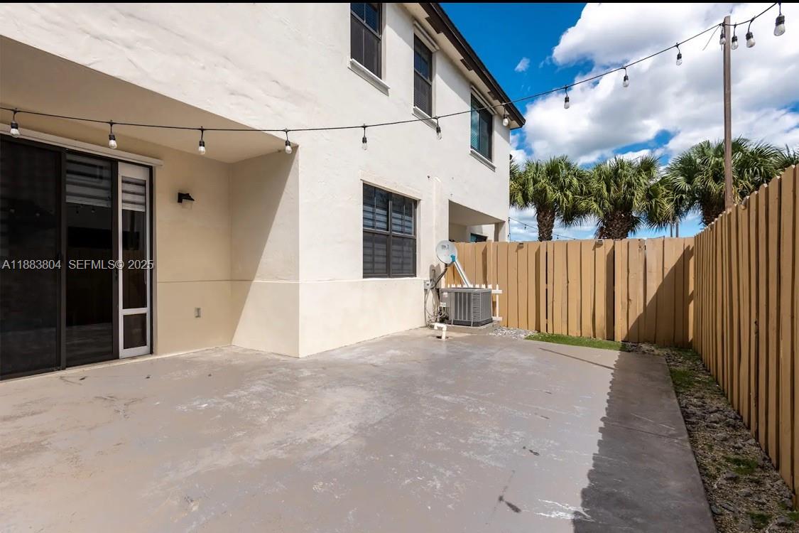 22509 Southwest 102nd Avenue Miami, FL 33190 - Photo 38 of 39 a view of a house with backyard and trees