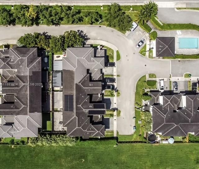 22509 Southwest 102nd Avenue Miami, FL 33190 - Photo 4 of 39 an aerial view of a house with a yard and lake view
