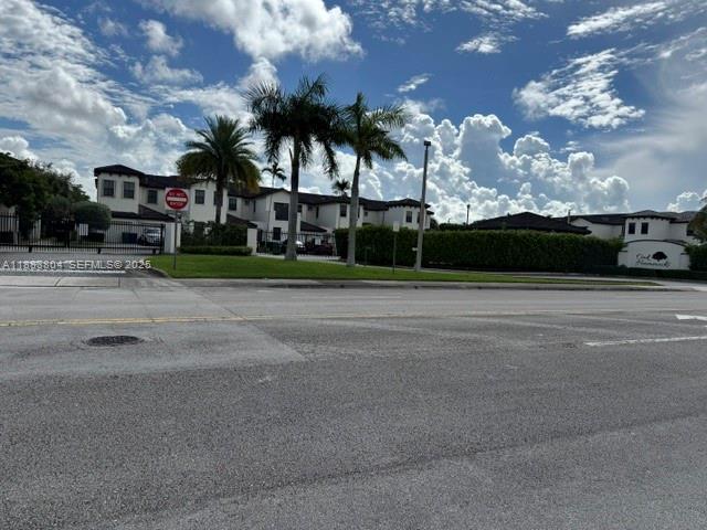 22509 Southwest 102nd Avenue Miami, FL 33190 - Photo 7 of 39 a view of street with tall buildings