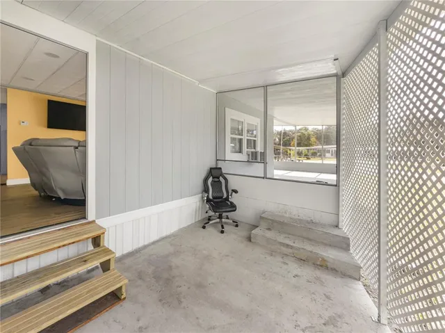 a room with gym equipment and a window