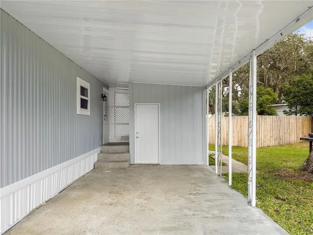 a view of an empty room with a balcony