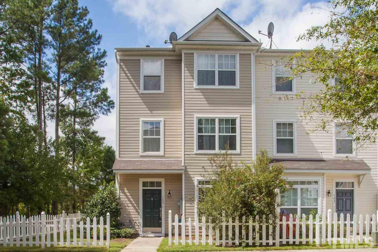 8631 Neuse Club Lane, Unit 100 Raleigh, NC 27616 - Photo 1 of 25 a front view of a house with a yard