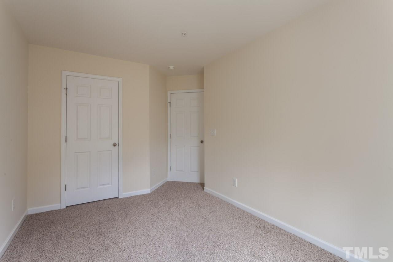 8631 Neuse Club Lane, Unit 100 Raleigh, NC 27616 - Photo 18 of 25 a view of an empty room