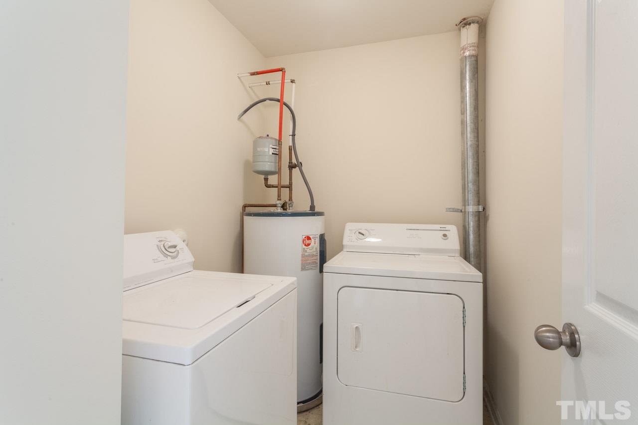 8631 Neuse Club Lane, Unit 100 Raleigh, NC 27616 - Photo 19 of 25 a utility room with dryer and washer