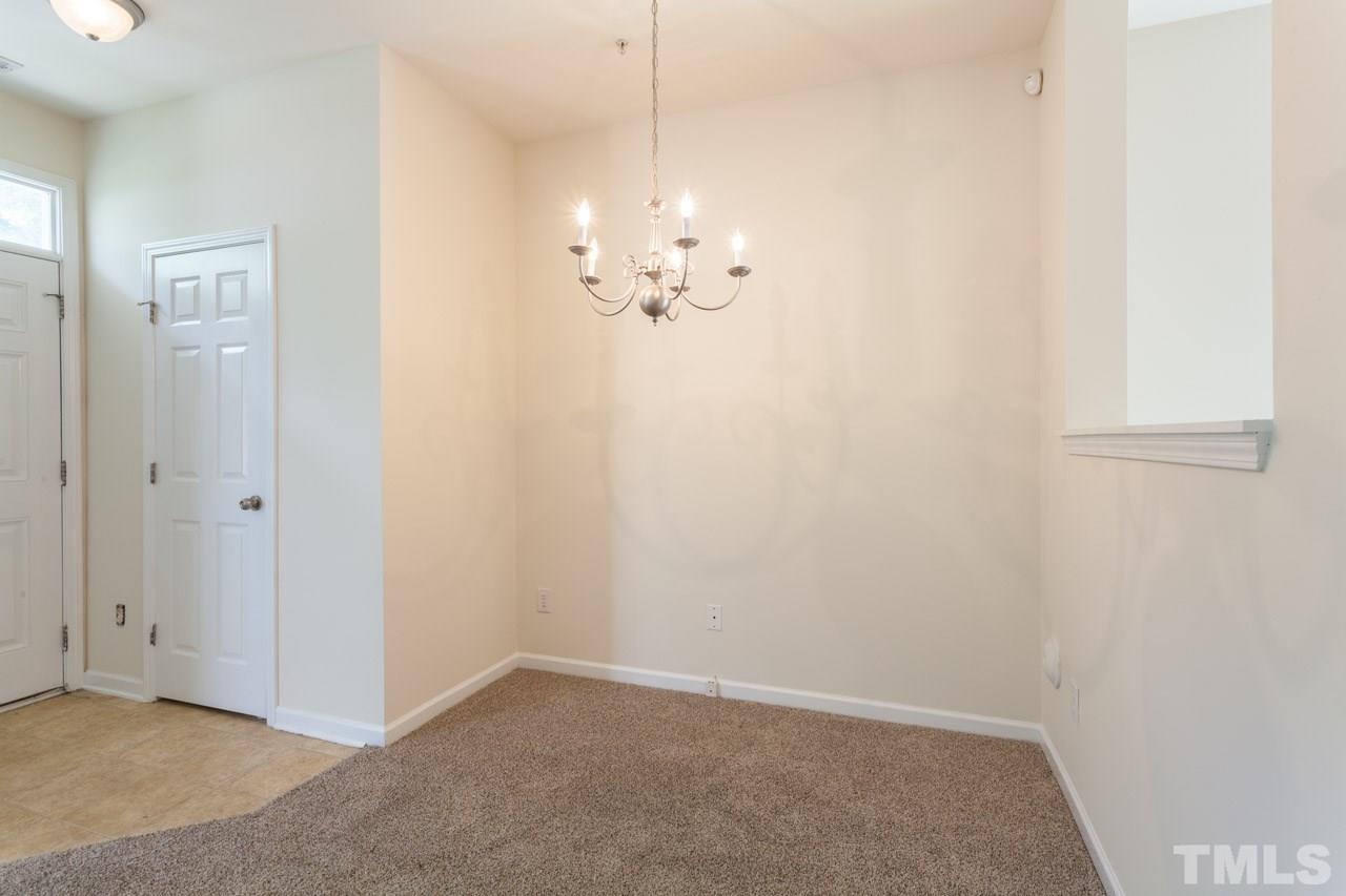 8631 Neuse Club Lane, Unit 100 Raleigh, NC 27616 - Photo 10 of 25 a view of a chandelier in big room