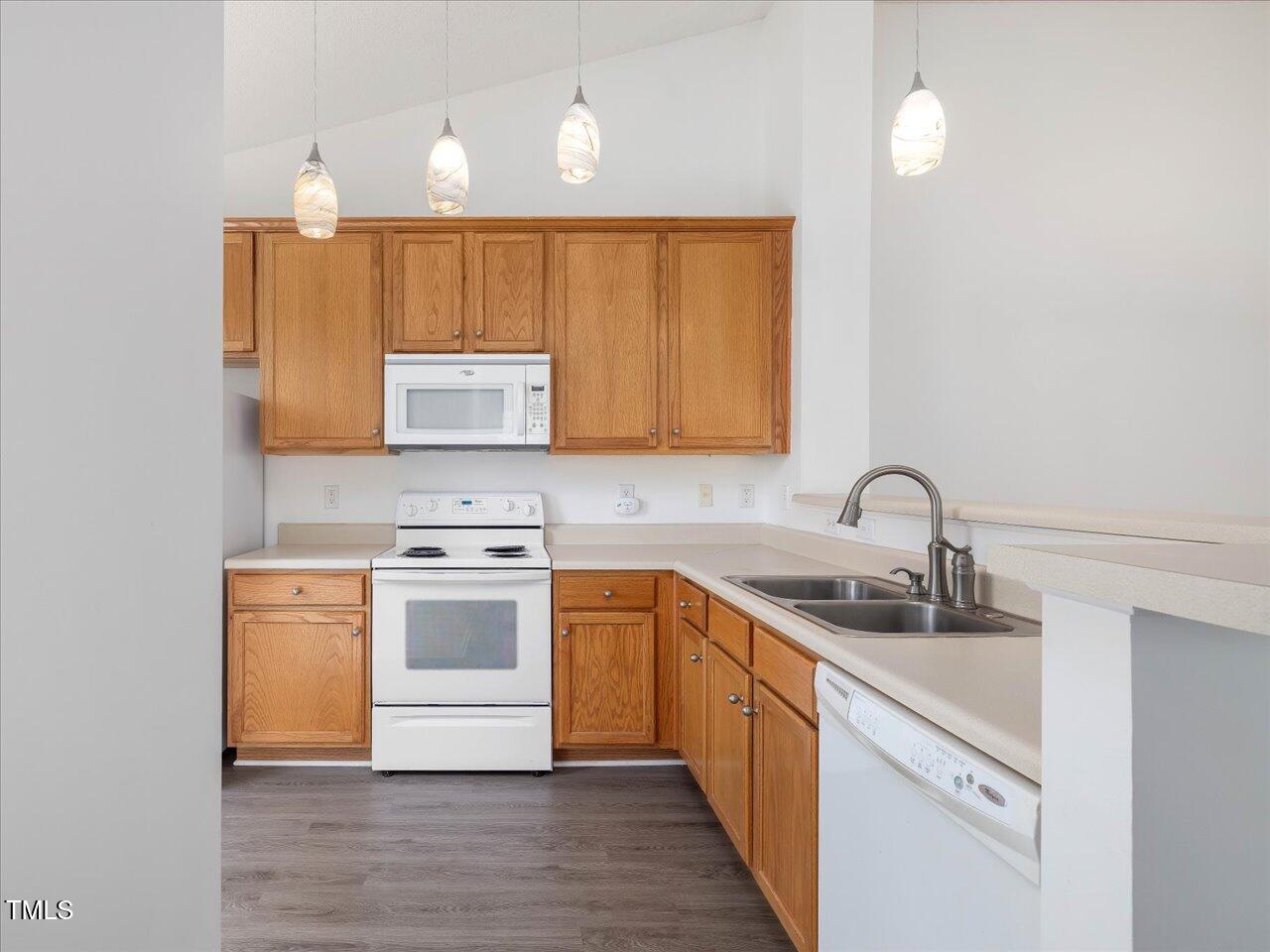 522 Auburn Square Drive Durham, NC 27713 - Photo 14 of 47 a kitchen with stainless steel appliances granite countertop a sink stove and cabinets