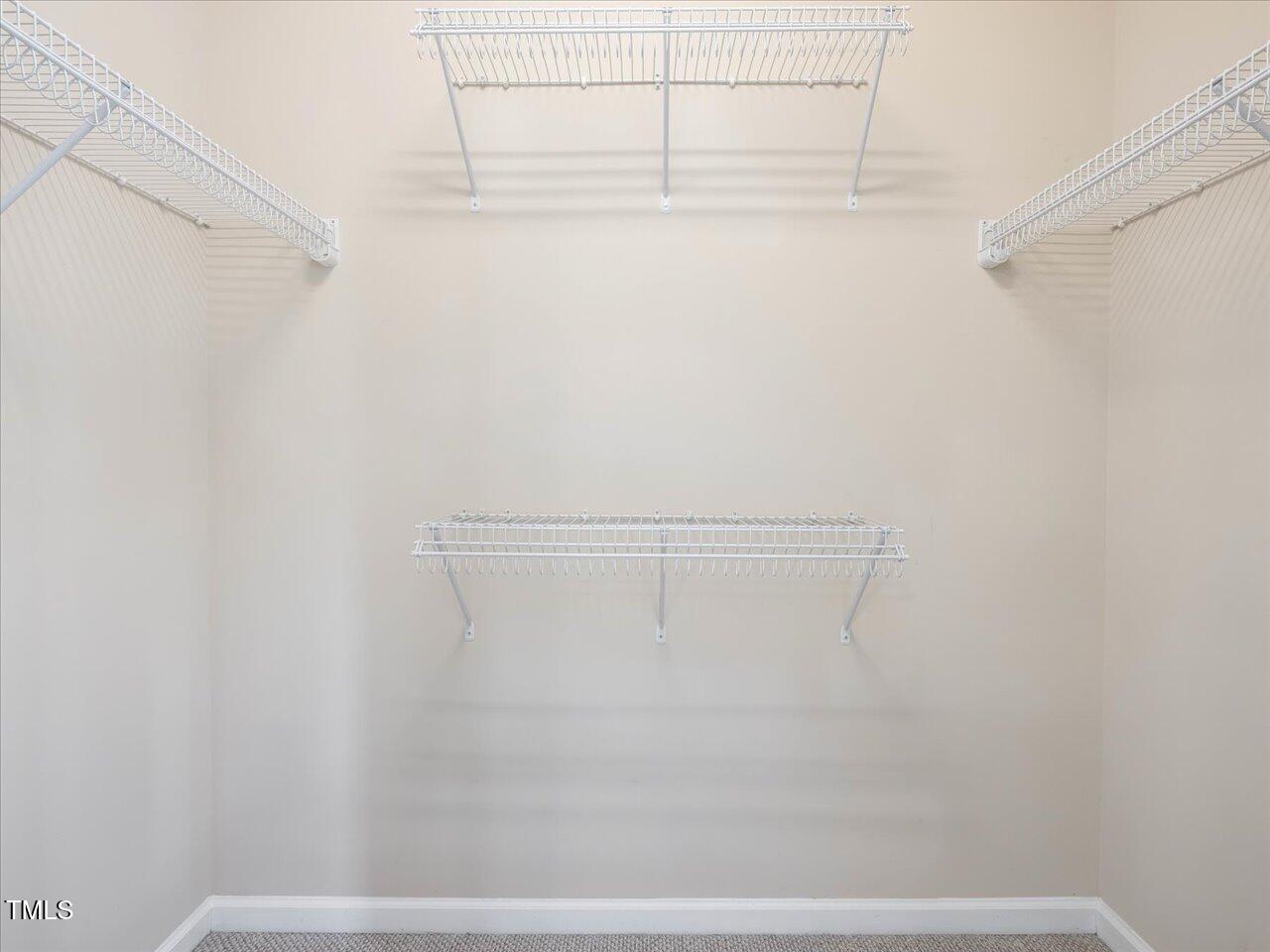 522 Auburn Square Drive Durham, NC 27713 - Photo 22 of 47 a view of a room with racks on the wall