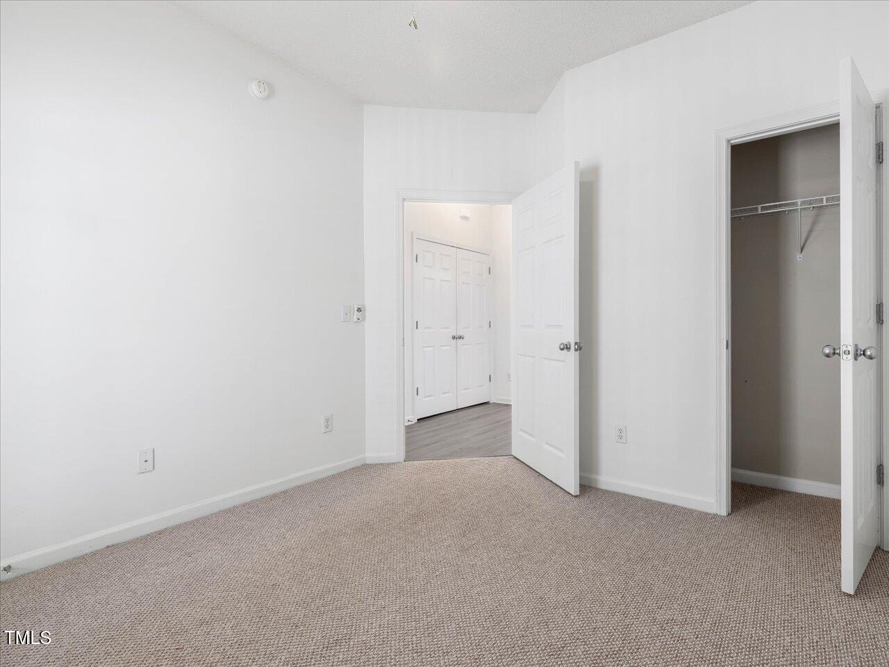 522 Auburn Square Drive Durham, NC 27713 - Photo 26 of 47 an empty room with closet area