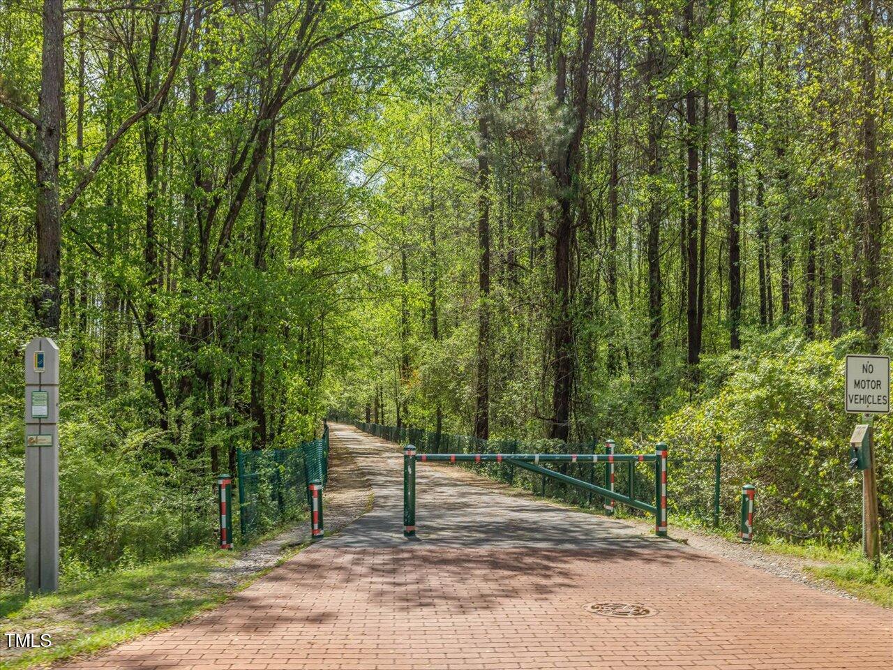 522 Auburn Square Drive Durham, NC 27713 - Photo 44 of 47 a view of a wooden fence and trees in the background