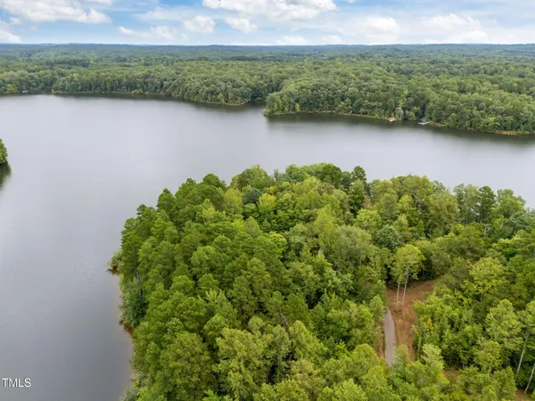 a view of lake with green space