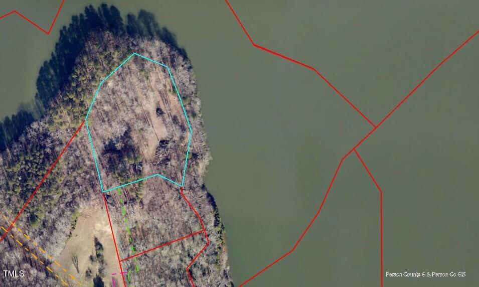 Lot 3 Grapevine Drive Roxboro, NC 27574 - Photo 5 of 17 a bathroom with a toilet and shower curtain