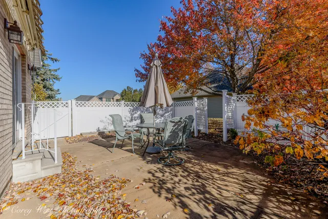 a view of a chair and table in the patio