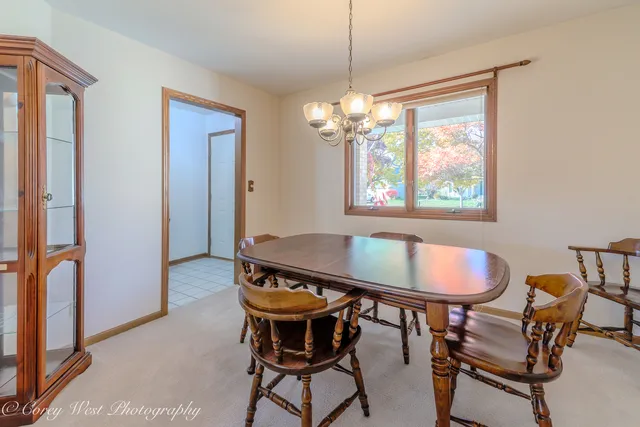 a dining room with furniture and window