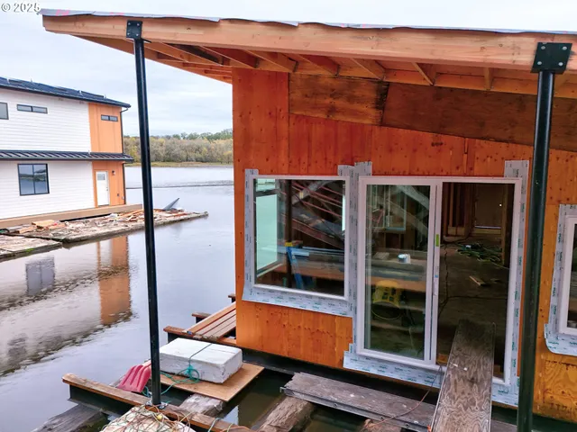 a room with pool table and glass door