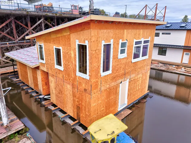 a view of a blue building with many windows