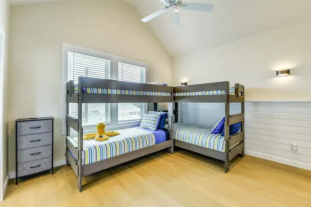 a bedroom with furniture and a window