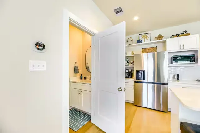 a view of walk in closet with empty racks