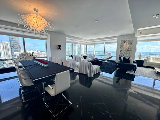 a bedroom with a large bed and a flat tv screen on a dresser