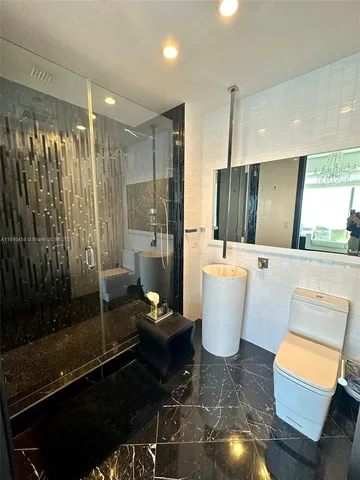 a view of balcony with wooden floor