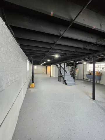a view of empty room with wooden ceiling