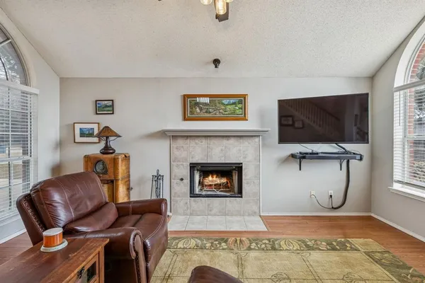 a living room with furniture and a fireplace