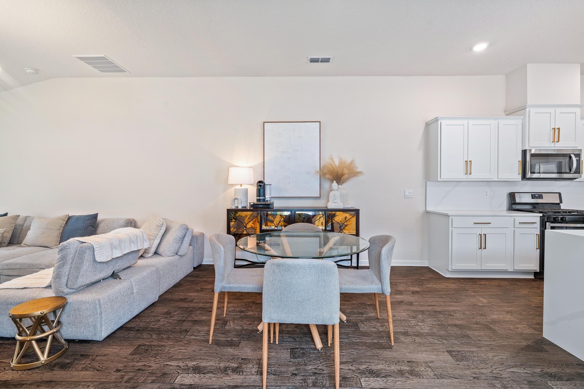 147 Logrono Court St. Augustine, FL 32084 - Photo 11 of 50 a living room with stainless steel appliances furniture a rug and a kitchen view